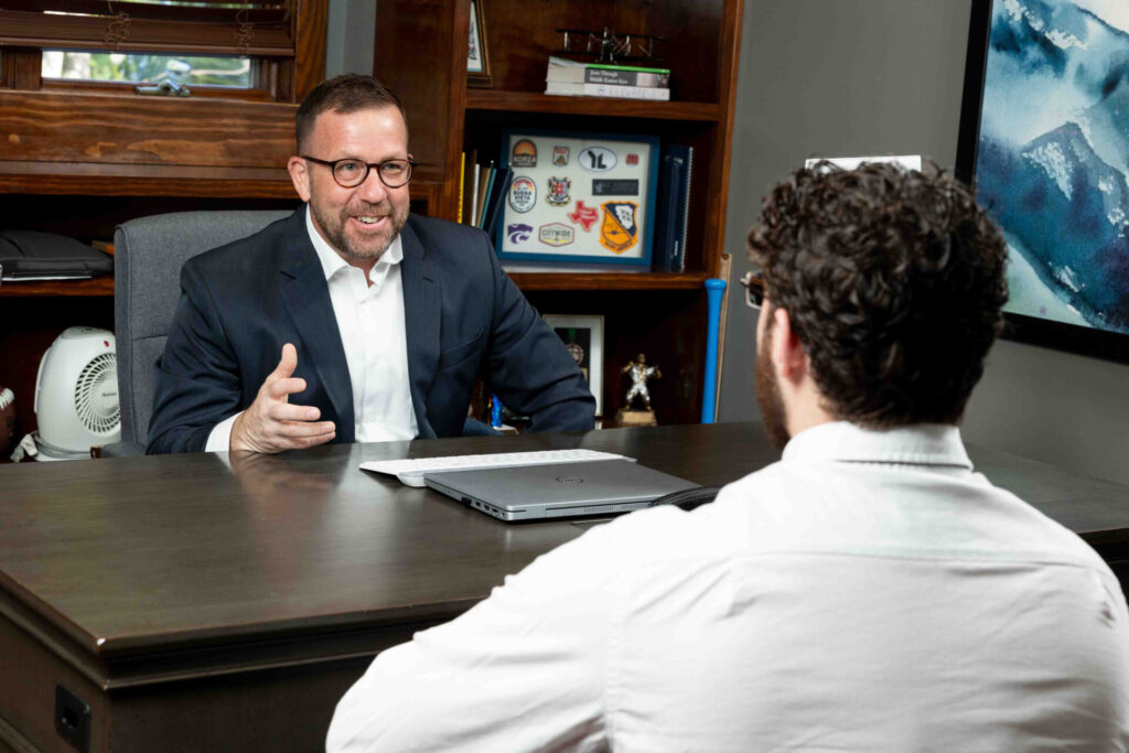 Kyle Johnson, founder of The Owner’s Playbook (OPB) is a coaching practice founded by Kyle Johnson, based in Topeka, Kansas. In session with a business owner.